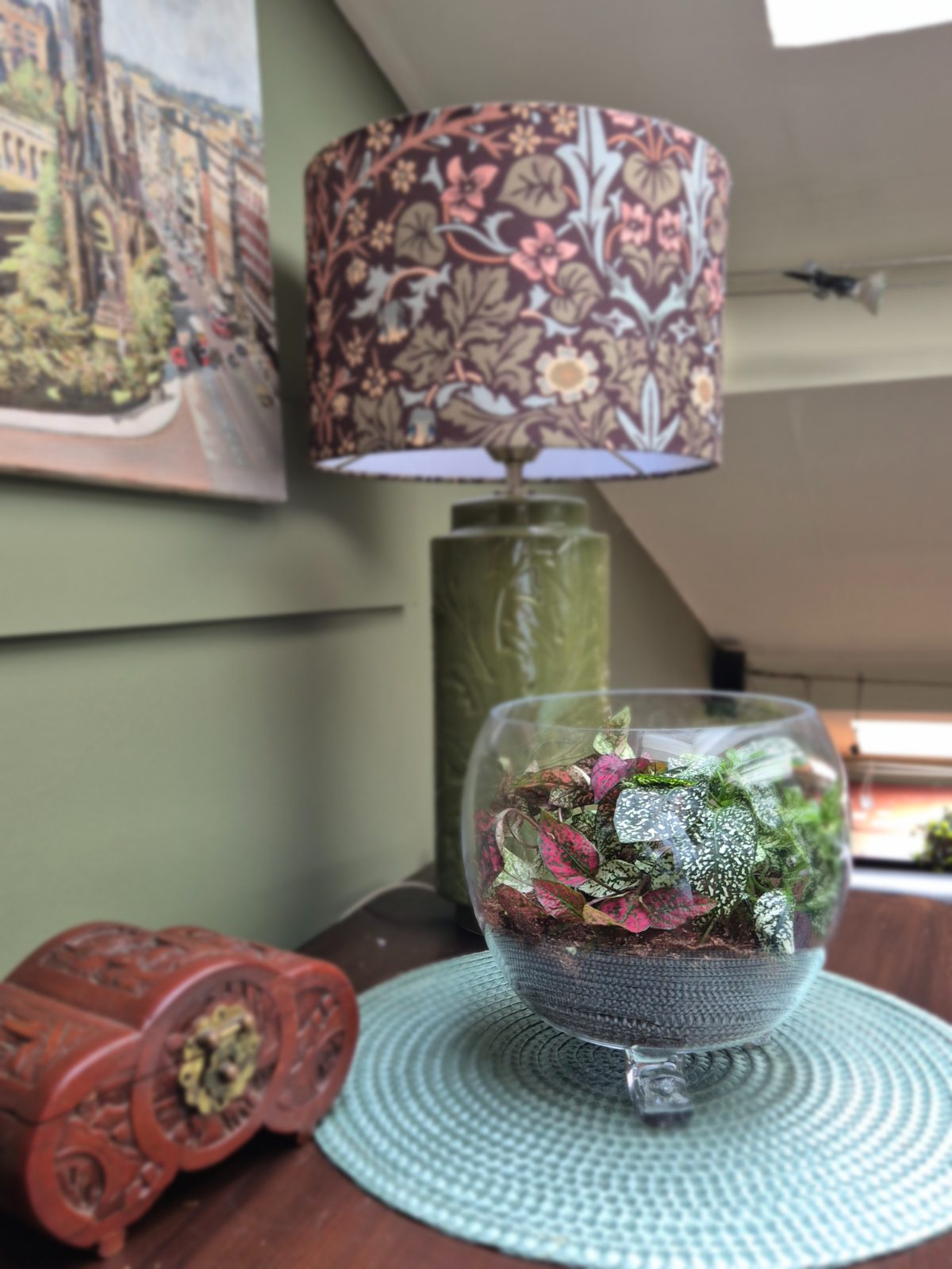 Freyven glass vessel arranged as a foliage terrarium